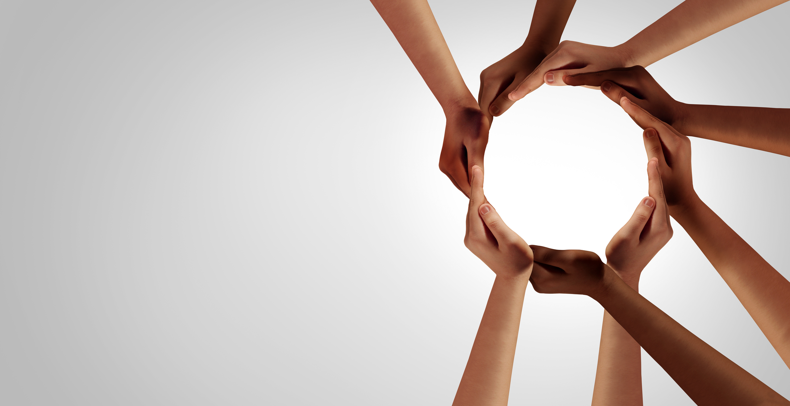 Image of eight hands forming a focal circle reminding of a boat's helm.